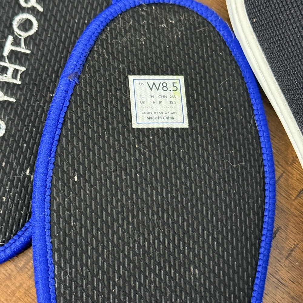 Rothy's The Original Slip On Sneaker in black solid with blue trim - Picture 7 of 8
